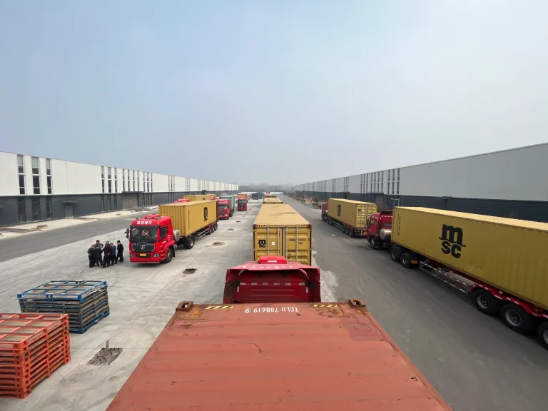 GTP Solar project equipment shipping containers and trucks loading at the factory yard for global delivery
